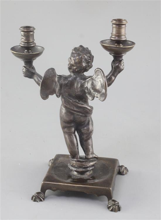 A Renaissance bronze candelabrum modelled as a cherub, height 9.25in.